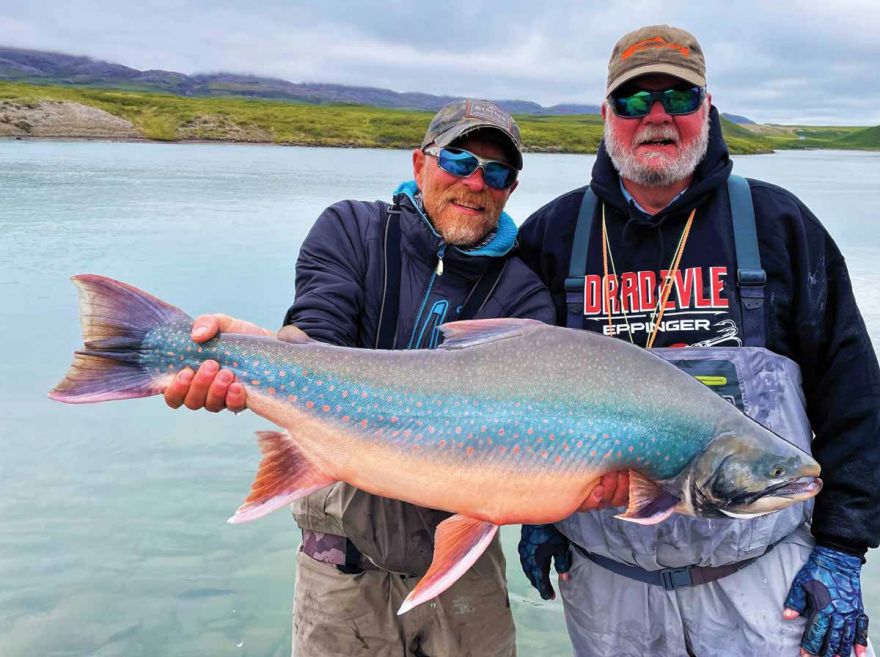 The ‘unicorn’ of the Arctic, a 37-inch behemoth char caught by Jim Craig. His guide Scotty Orr is doing the heavy lifting.